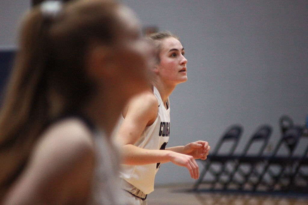 Sophomore Guard Sofia Popp, right, watches the ball